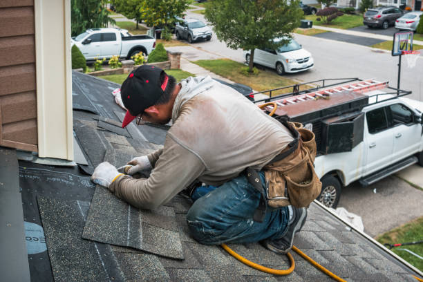 Professional Roofing technician working in Lexington, OR